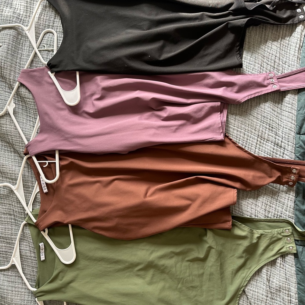 Set of Four Sleeveless Bodysuits in Black, Purple, Brown, and Green